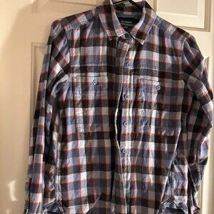 REI Co-op Wallace Lake flannel shirt in a blue, gray, and orange plaid